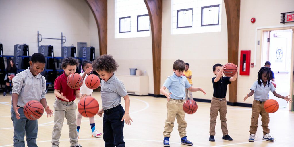 A group of elementary students playing basketball