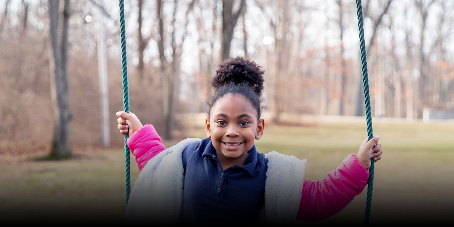 Smiling student at the playground